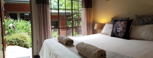 Tempat tidur dalam kamar di Lidwala Lodge