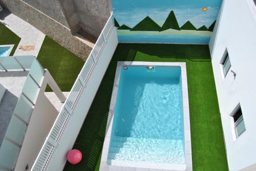 an overhead view of a swimming pool in a house at Big Villa Tauro with Private Heated Saltwater Pool & jacuzzi & BBQ & Game Room in Mogán