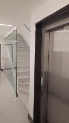 a glass door in a building with a staircase at LIVING ROME Int 2 in Rome