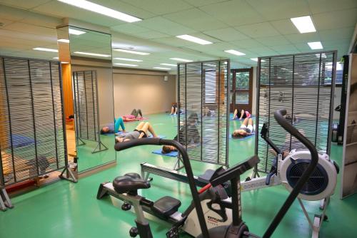 a gym with several people doing exercises in the water at VVF Lac Léman Évian-les-Bains in Évian-les-Bains