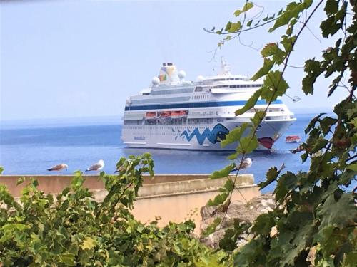 a cruise ship is docked in the ocean at Casa Mafalda B&B in Lipari
