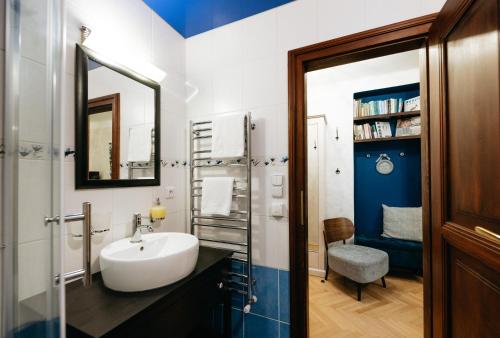a bathroom with a sink and a mirror at Boutique Hotel Romantick in Český Krumlov