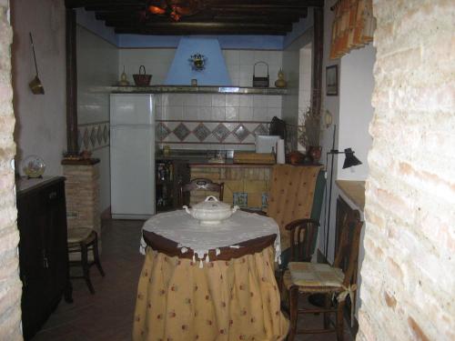 a kitchen with a table with a bowl on top of it at Casa Rural La Villa in Castro del Río