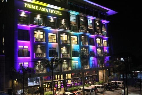 a building with purple and blue lights on it at Prime Asia Hotel in Angeles