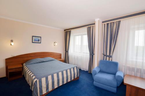 Кровать или кровати в номере Отель Максима Славия