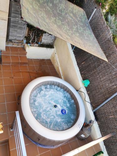a bath tub with a toilet in the ground at BEACH HOUSE. CASA CON PISCINA PRIVADA in Calafell