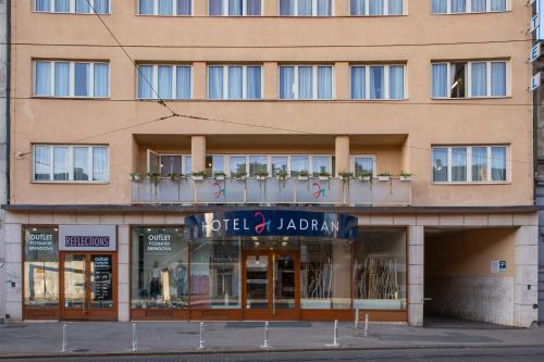 a building with a sign that reads hotel jarlatown at Hotel Jadran in Zagreb