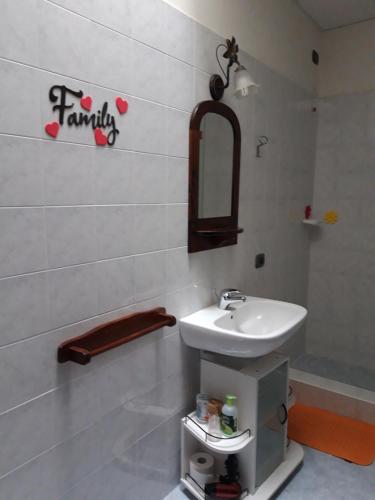 a bathroom with a sink and a mirror on the wall at BorgoAntico Affittacamere in Soave