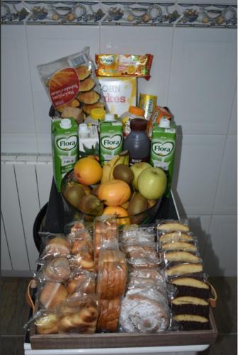 a tray filled with different types of food on a table at BEACH HOUSE. CASA CON PISCINA PRIVADA in Calafell