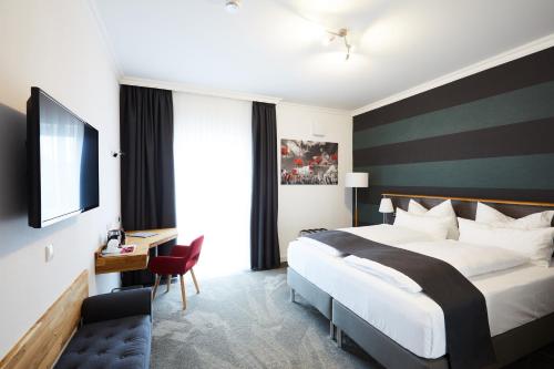 Hotel Garni am Schloss tesisinde bir odada yatak veya yataklar