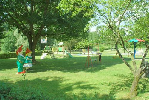 a park with a playground with a swing at Traditions-Gasthaus Bayrischer Hof in Leutkirch im Allgäu