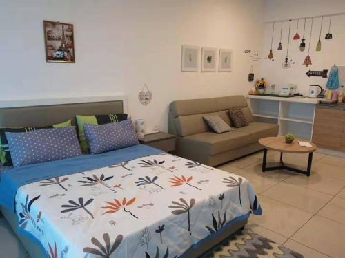 a bedroom with a bed and a living room at Harmony Studio @ Evo SOHO Bangi in Kampong Sungai Ramal Dalam