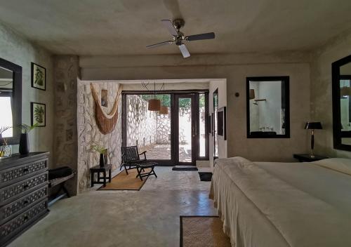 a living room filled with furniture and a window at Coqui Coqui Papholchac Coba Residence & Spa in Coba