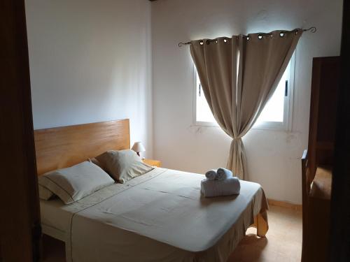 En eller flere senge i et værelse på Residencial Mira Rio