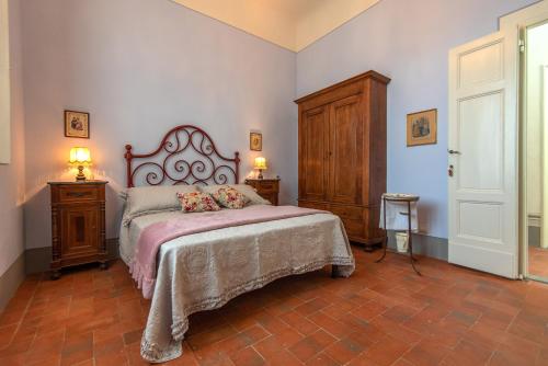Ένα ή περισσότερα κρεβάτια σε δωμάτιο στο Agriturismo Villa Ulivello in Chianti
