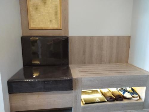 a room with a counter with shoes in it at Hotel De Sripoom in Chiang Mai