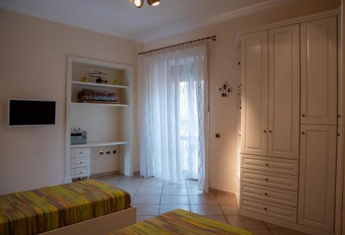Ένα ή περισσότερα κρεβάτια σε δωμάτιο στο Solimena House