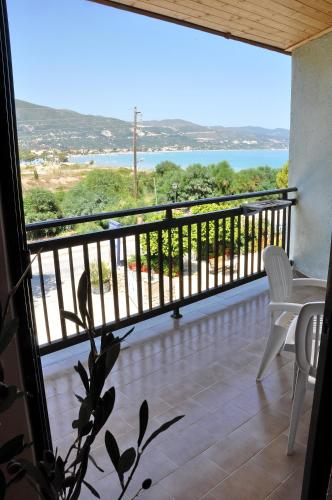 a balcony with a view of the water at Valais Hotel in Alikanas