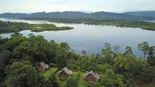 an aerial view of a lake with houses and trees at Nathylodge in Bocas del Toro