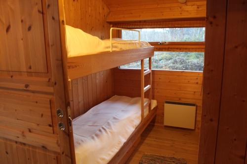 Двухъярусная кровать или двухъярусные кровати в номере Milonga - 3 bedroom cabin