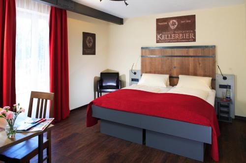 Säng eller sängar i ett rum på Brauerei Gasthaus Lohhof