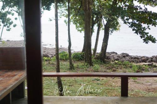 a view of the beach from a window at Villa Allure Koh Mak in Ko Mak