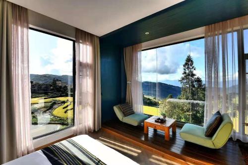 a bedroom with a large window with a view at The Twelve Manor•Terraces Lodge in Yuanyang