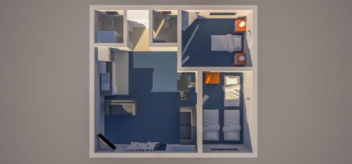 a floor plan of a room with blue walls at Kaitaia Motor Lodge in Kaitaia