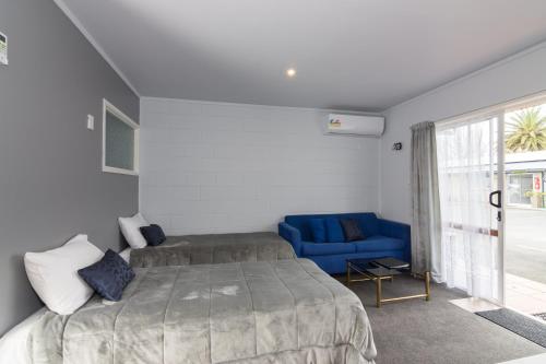 Postel nebo postele na pokoji v ubytování Kaitaia Motor Lodge
