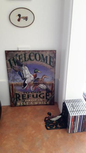 a welcome to the refuge sign on a wall at Rivendell in Geraldine