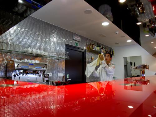 a man standing in a kitchen with a woman at EA Hotel Tereziánský dvůr in Hradec Králové