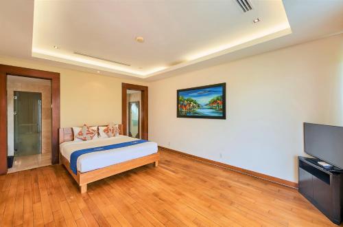Ένα ή περισσότερα κρεβάτια σε δωμάτιο στο Sunny Beach Villa