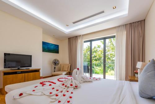 Ένα ή περισσότερα κρεβάτια σε δωμάτιο στο Sunny Beach Villa