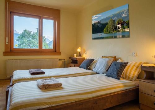 Postel nebo postele na pokoji v ubytování Alpeambient house Dovje