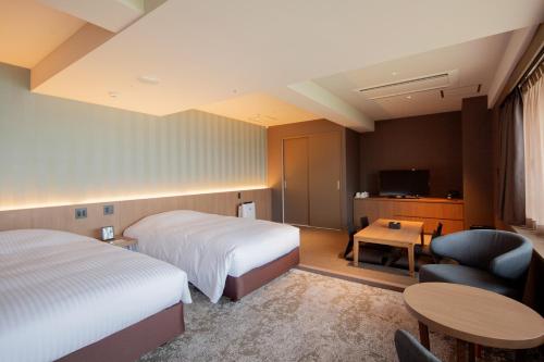Voodi või voodid majutusasutuse Art Hotel Kokura New Tagawa toas
