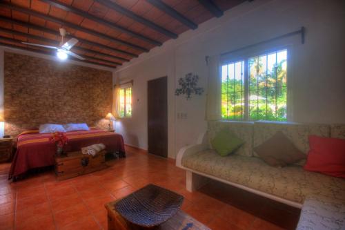 Postel nebo postele na pokoji v ubytování Bungalows Las Margaritas 10