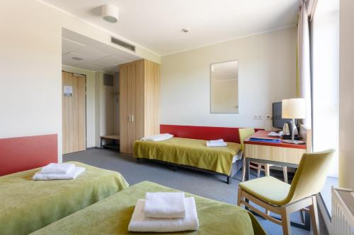 Ένα ή περισσότερα κρεβάτια σε δωμάτιο στο Aqua-Zdrój