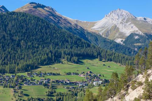 a small village in a valley in the mountains at Boutique-Hotel Garni Bellevue Davos Wiesen in Wiesen