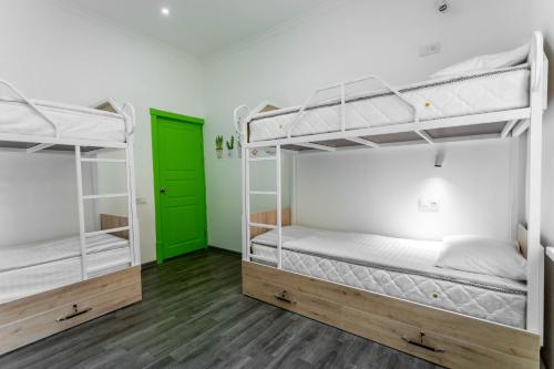Postel nebo postele na pokoji v ubytování Registan Hostel