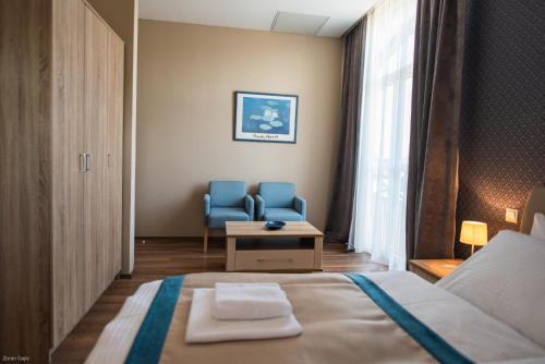 Кровать или кровати в номере Hotel & Distillery Monogram