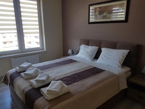 Posteľ alebo postele v izbe v ubytovaní Apartament Bałtyk Polanki Park, basen, sauna, fitness, sala zabaw dla dzieci