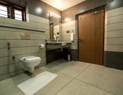 a bathroom with a toilet and a sink at Villa De 1945 in Mahe