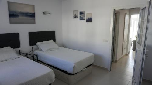 En eller flere senger på et rom på Apartamento Puerto del Carmen Las Vistas 247