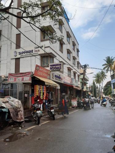 a building on the side of a city street at Sapphire Inn in Bangalore