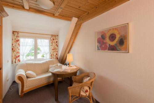 a living room with a couch and a table at Landgasthof Keller in Überlingen