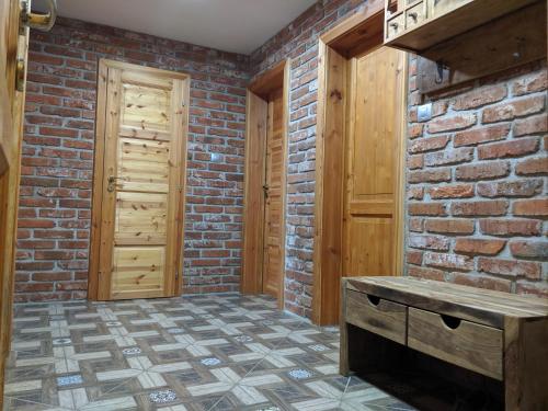 a brick room with a bench and a brick wall at Luxury Apartment in Sumava National Park in Nová Pec