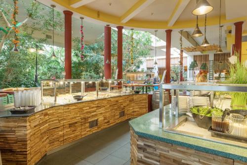 a restaurant with a buffet of food on display at Center Parcs Sauerland Winterberg-Medebach in Medebach