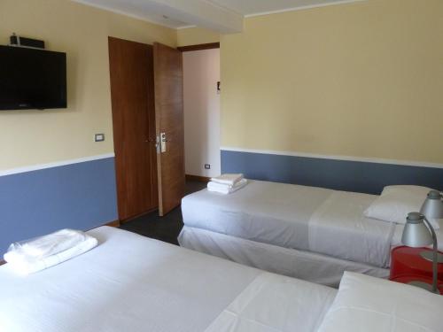 Ένα ή περισσότερα κρεβάτια σε δωμάτιο στο GUANAKO Hostel