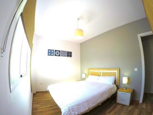 Postel nebo postele na pokoji v ubytování Nina Apartment