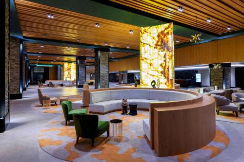 a lobby of a hotel with chairs and tables at Elite World Grand Sapanca in Sapanca